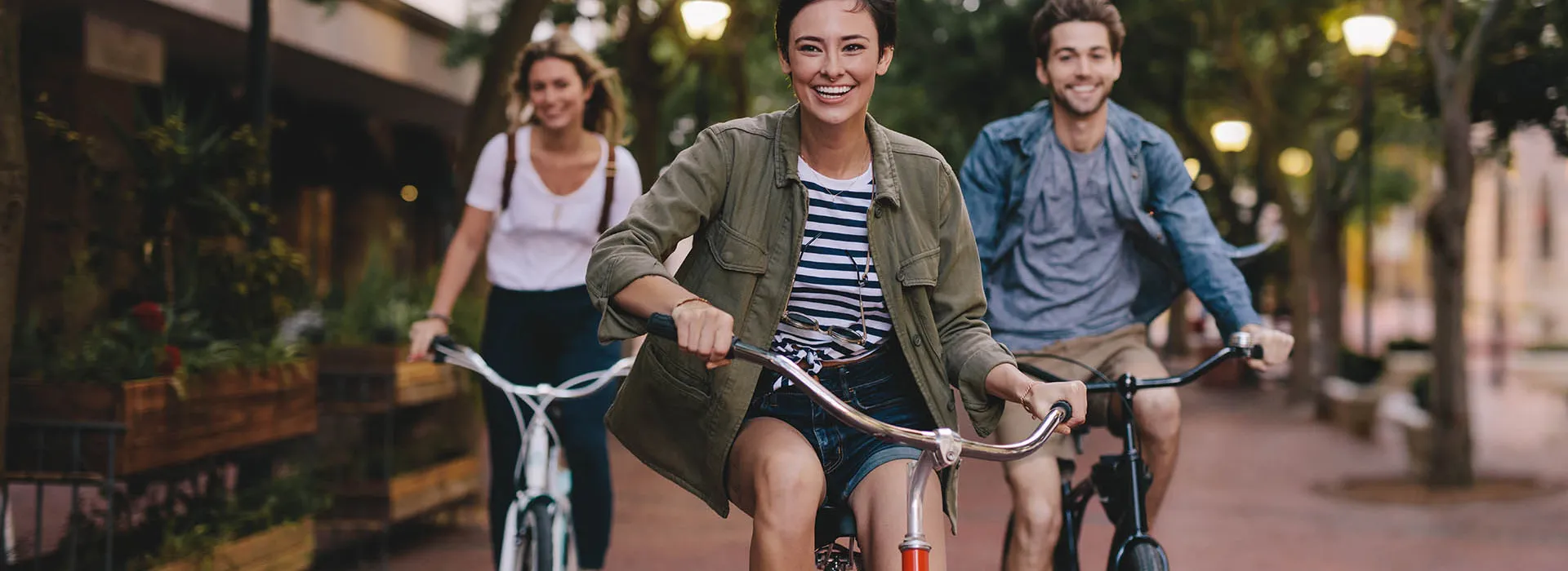 three friends on bicycles
