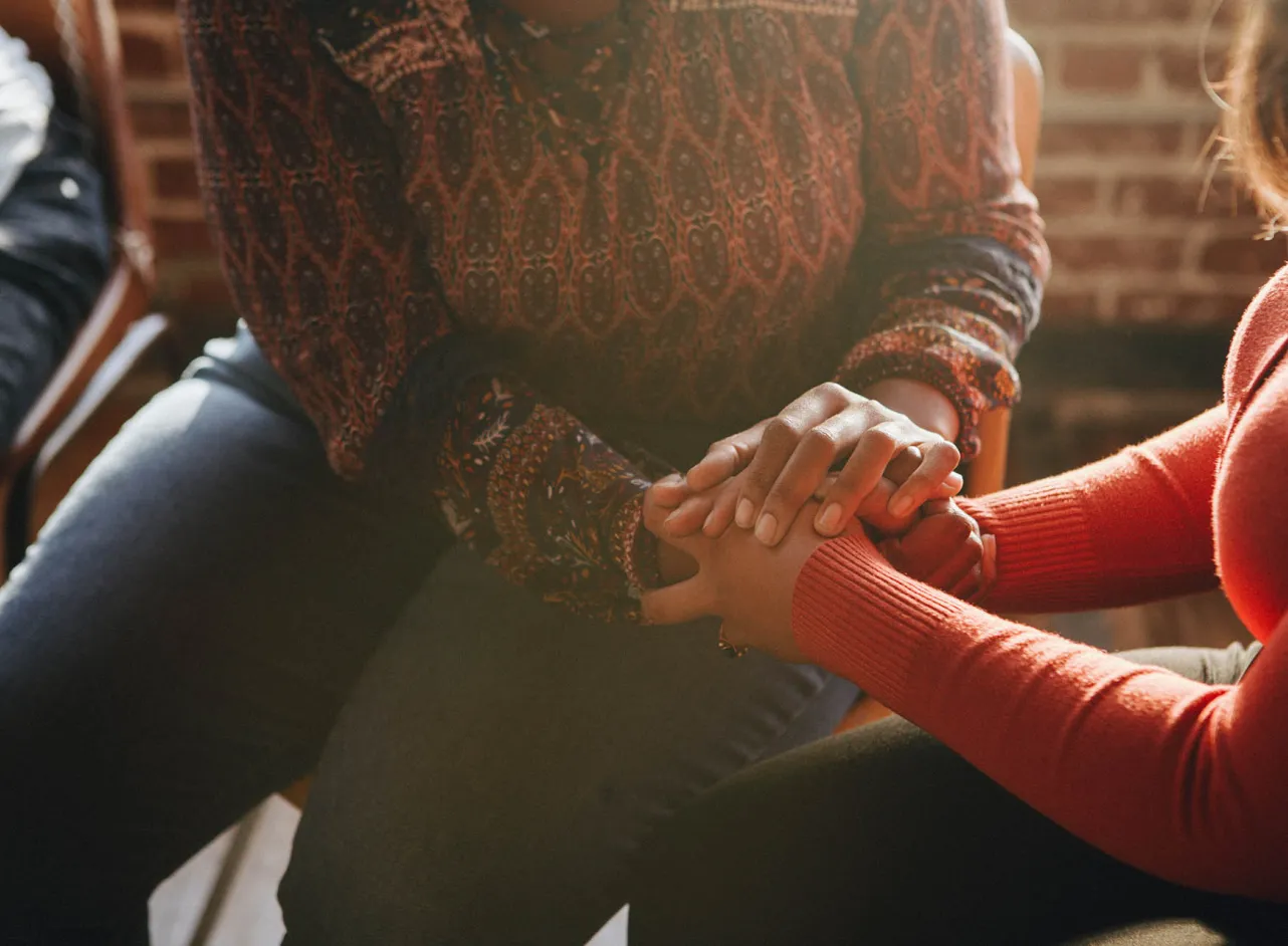 two people holding hands 